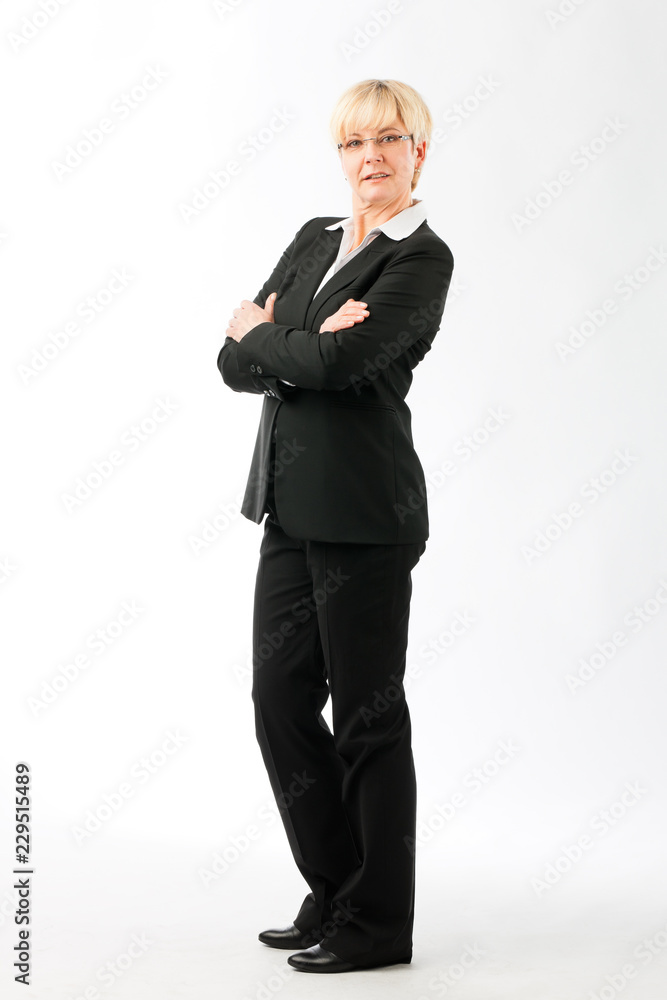 Confident mature businesswoman with her folded arms isolated over white background Confident mature businesswoman with her folded arms isolated over white background