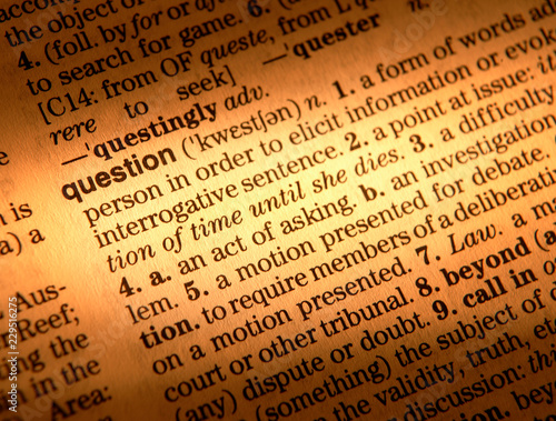 CLOSE UP OF DICTIONARY PAGE SHOWING DEFINITION OF THE WORD QUESTION