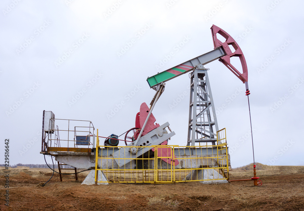 Oil and gas industry. Panoramic of a pump jack and oil refinery. Oil and gas industry. Panoramic of a pump jack and oil refinery.