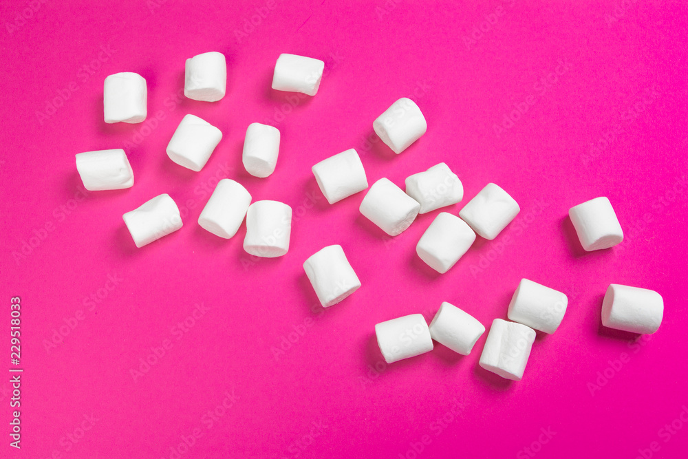 marshmallows on a pink background. top view marshmallows on a pink background. top view