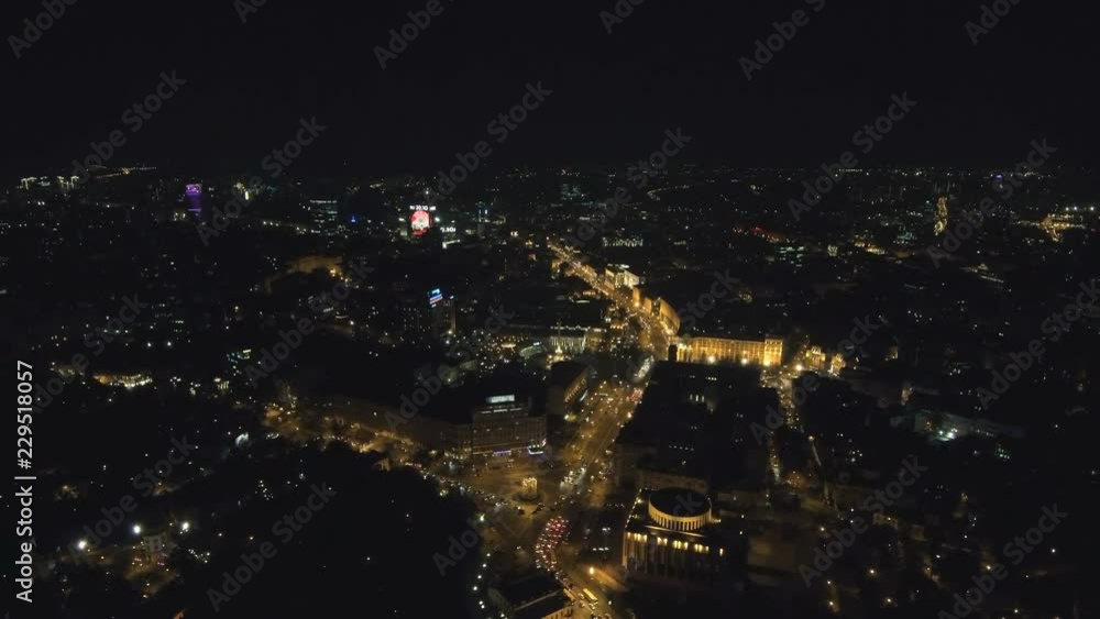 Aerial view from Drone: Night city flying over the road and night lights. The movement of cars on the night road. Aerial view from Drone: Night city flying over the road and night lights. The movement of cars on the night road.