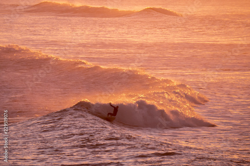 Early morning surfer, Taranaki New Zealand