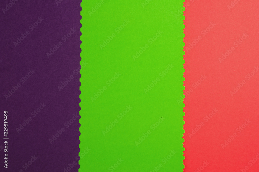 Fototapeta premium Three blank papers red and green and violet color with figured cutted border. Top view. Education concept