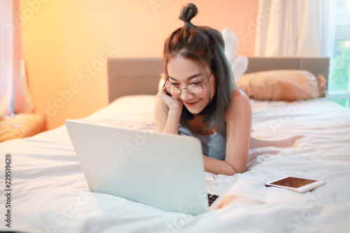 beautiful and sexy woman using laptop computer before go to sleep