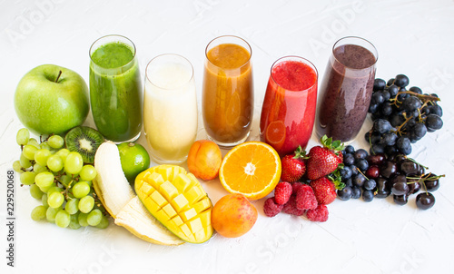 Fresh Color Juices Smoothie Green Yellow Red Orange Violet White Tropical Fruits Mango Melon Kiwi Strawberry Banana Peaches Grapes Glass White Background Summer Concept