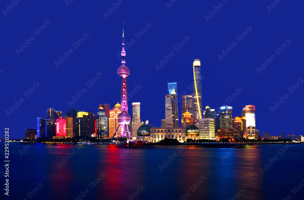 colorful lights and futuristic skyline of skyscrapers on river of shanghai pudong skyscrapers, China
