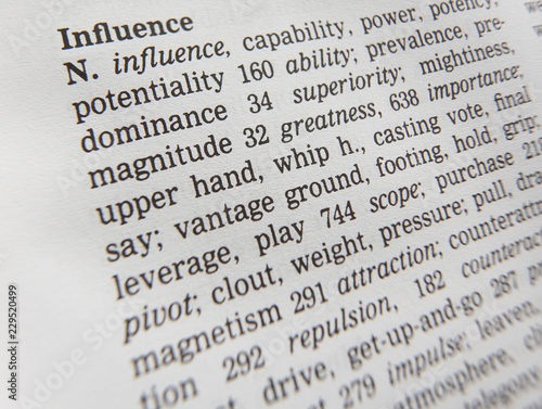 Obraz na płótnie CLOSE UP OF DICTIONARY PAGE SHOWING DEFINITION OF THE WORD INFLUENCE