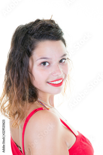 cute young woman with red lips on a light background in portrait