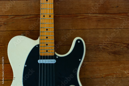 Vintage Electric Guitar on a Wooden Floor
