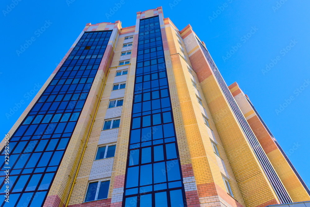 Multi-storey building stretches to the sky. Multi-storey building stretches to the sky.