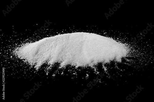 Crystal sugar pile isolated on black background with clipping path