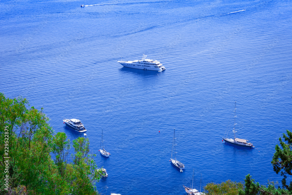 Obraz premium Sailboats near the sea shore of Taormina, Sicily, Italy
