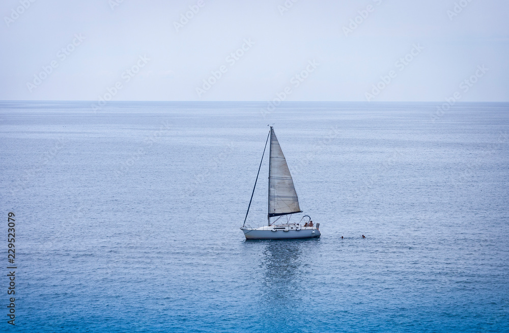 Sailboat near the sea shore of Acitrezza, Catania, Sicily, Italy