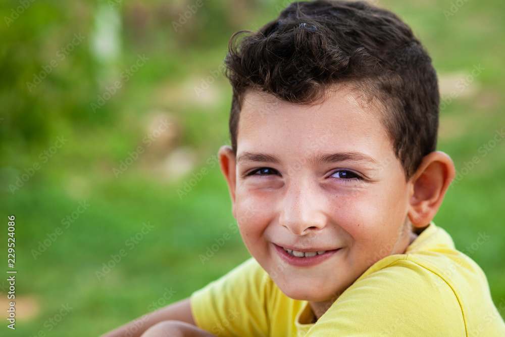 Portrait of happy cute child boy outdoors. Concept of happy family or successful adoption or parenting. Portrait of happy cute child boy outdoors. Concept of happy family or successful adoption or parenting.