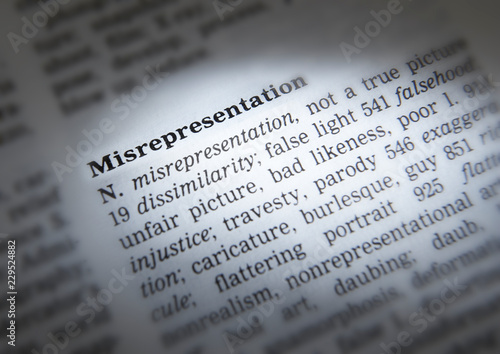 DICTIONARY PAGE SHOWING DEFINITION OF THE WORD MISREPRESENTATION photo