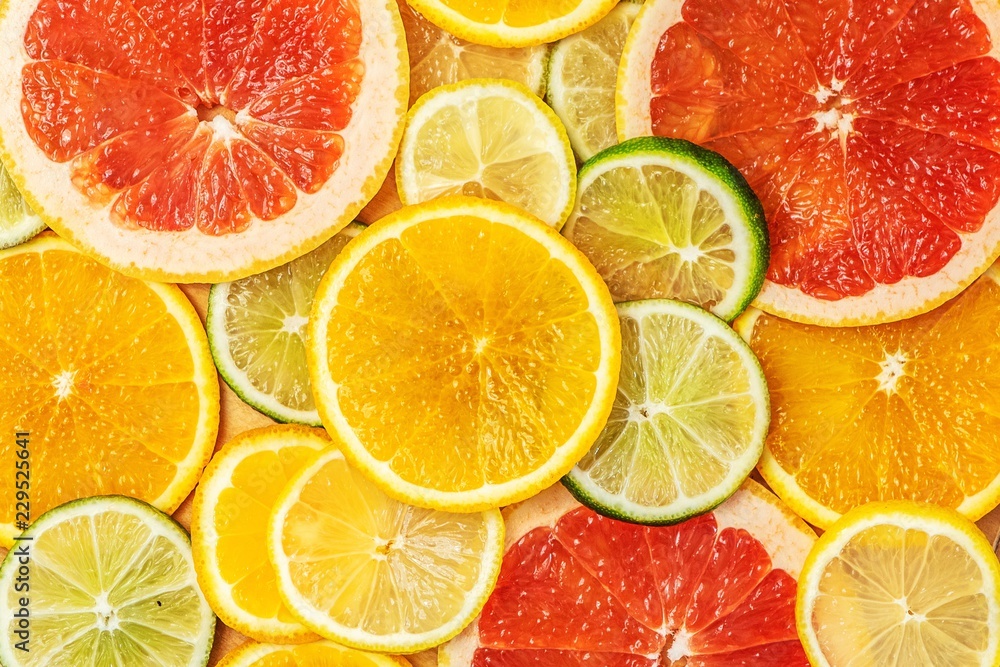 Mixed Fresh slices citrus fruit as background. Top view Mixed Fresh slices citrus fruit as background. Top view