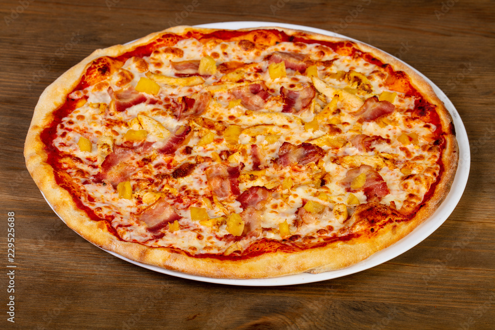 Pizza with bacon and pineapple