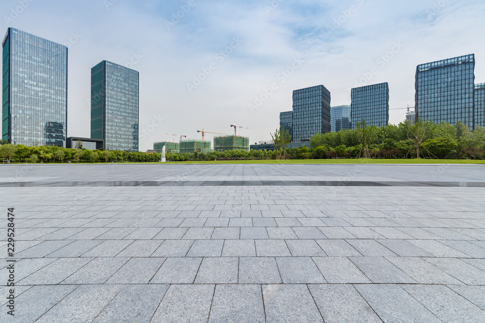 Panoramic skyline and modern business office buildings with empty road,empty concrete square floor