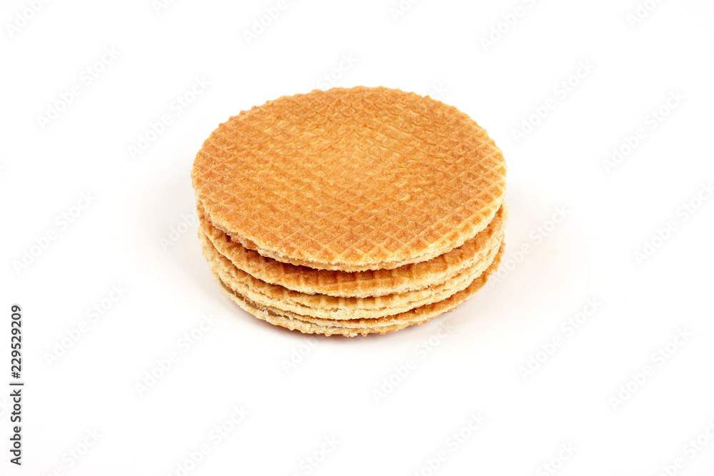Dutch waffle called a stroopwafel isolated on a white background. Dutch waffle called a stroopwafel isolated on a white background.