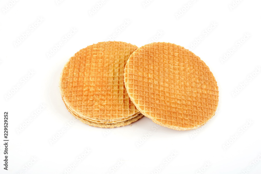 Dutch waffle called a stroopwafel isolated on a white background. Dutch waffle called a stroopwafel isolated on a white background.