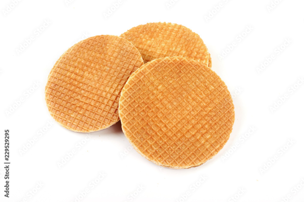 Dutch waffle called a stroopwafel isolated on a white background. Dutch waffle called a stroopwafel isolated on a white background.