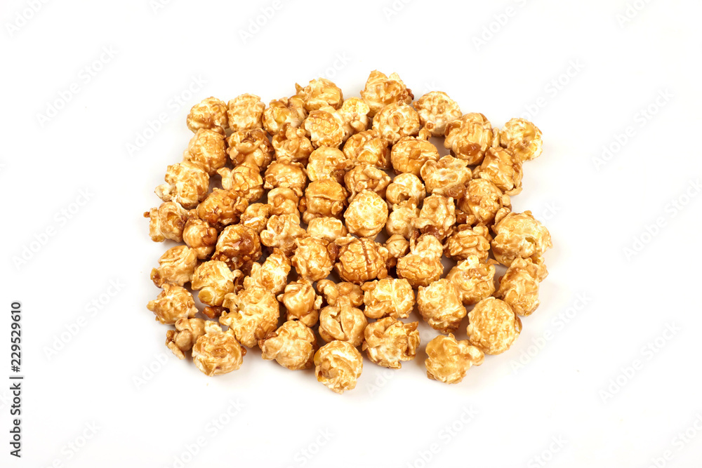Pile of caramel popcorn on white background. Pile of caramel popcorn on white background.