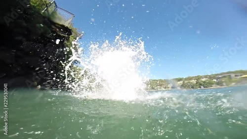 Wallpaper Mural Man jumping in the water from a cliff in Australia Torontodigital.ca