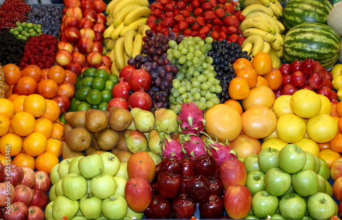 Fototapeta Naklejka Na Ścianę i Meble -  Farmers market with various colorful fresh healthy fruits for sale. A big choice of ripe various fresh fruits  on market
