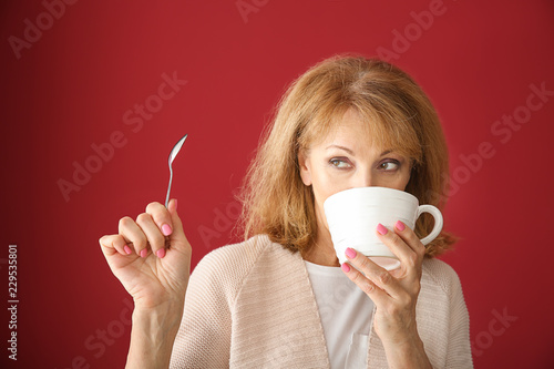 Beautiful mature woman drin...