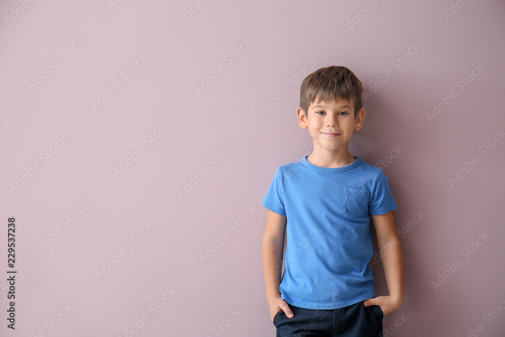 Cute little boy in t-shirt on color background Cute little boy in t-shirt on color background