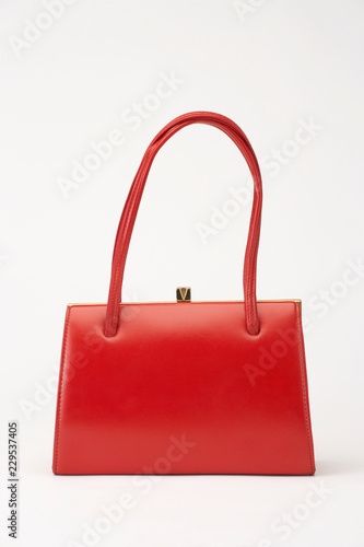 RED WOMENS LEATHER HANDBAG ISOLATED ON WHITE BACKGROUND