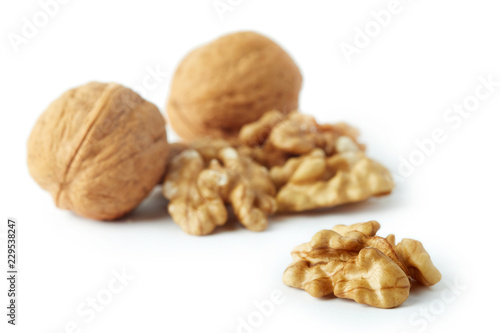 Close up of walnut kernels isolated on white background