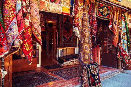 Amazing traditional handmade turkish carpets in souvenir shop. photo