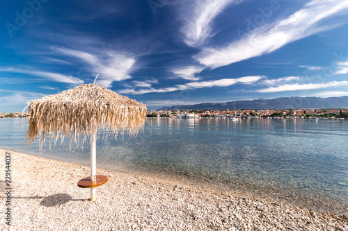 Straw umbrella on Croatian Beach, Novalja
