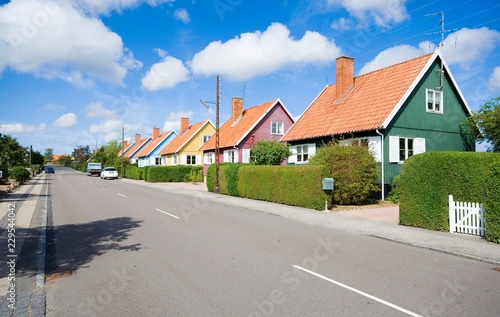 Traditional colorful wooden Swedish houses in the suburbs of Nexo, Bornholm, Denmark. The houses are the gift from Swedish state after the end of the Second World War