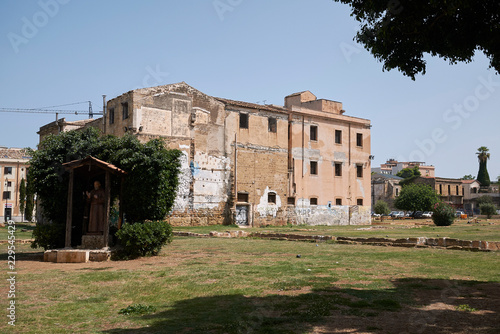 Palermo, Italy - September 06, 2018 : View of Piazza Magione garden and Ex Chiesa e Collegio di S Maria della Sapienza