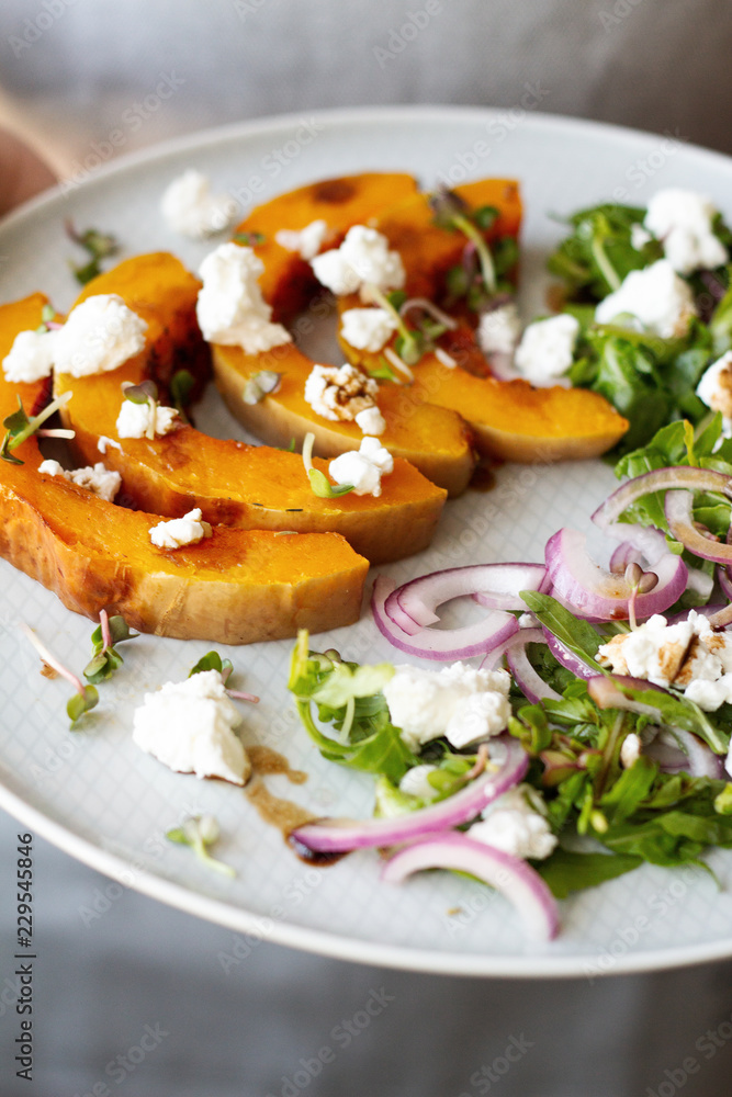 baked pumpkin with feta, arugula and red onion.