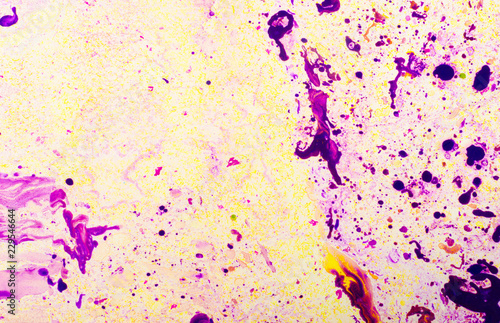 Abstract background for text or image. Ebru technique. Modern art. Marbled paper. Marbleized effect. Marble paper texture. Yellow and violet.