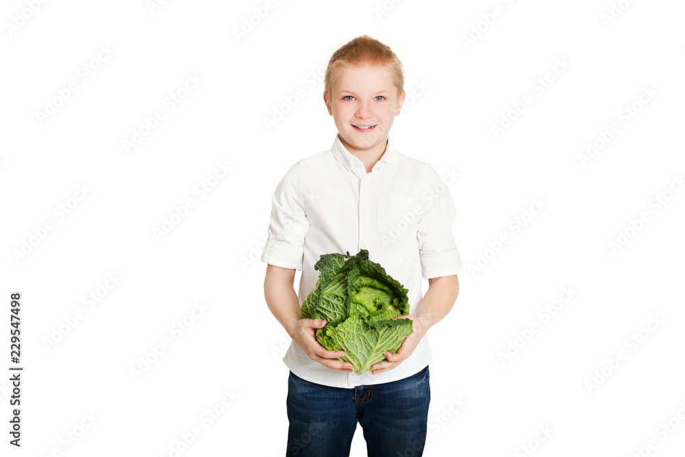 Happy boy with vegetable cabbage
on a white background. Concept of healthy vegetarian food Happy boy with vegetable cabbage
on a white background. Concept of healthy vegetarian food