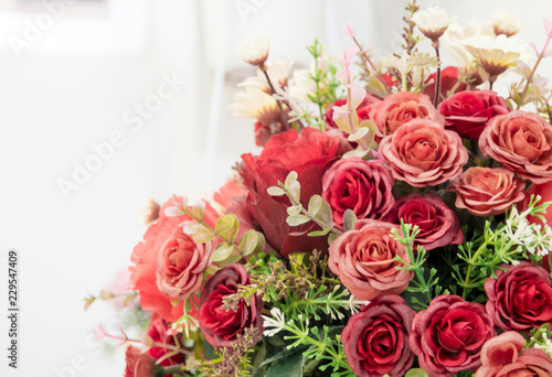 Plastic roses in artificial flower bouquet