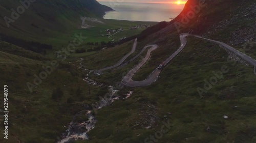 View of the Sun Setting over the Horizon at Hoddevik photo