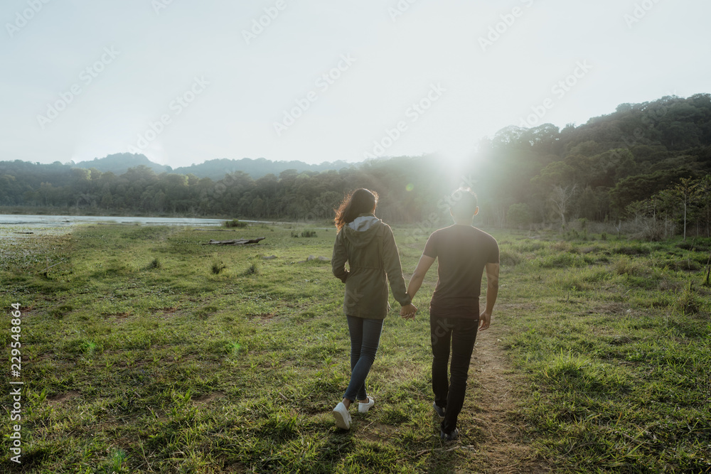 happy young asian couple in countryside enjoying nature happy young asian couple in countryside enjoying nature