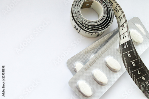 Diet pills on white background photo