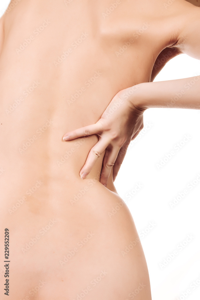 Fototapeta premium woman's back view and nude sitting on the bed