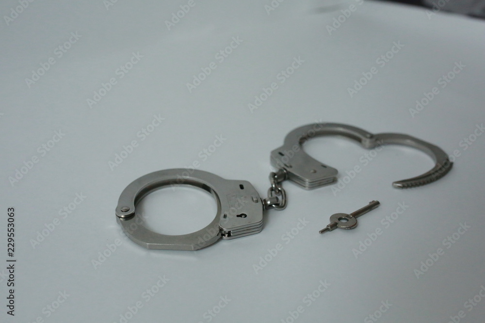 handcuffs on black background handcuffs on black background