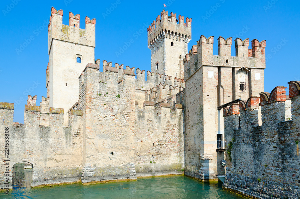 Castle of Scaligers (second half of 12th - early 13th century) on shore of Lake Garda in resort town of Sirmione, Italy