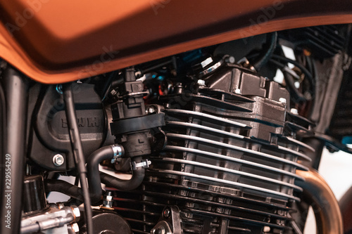 Engine design details, radiator from customized motobike in Italy, Rome. Black parts, chrome pipings. © Edward R