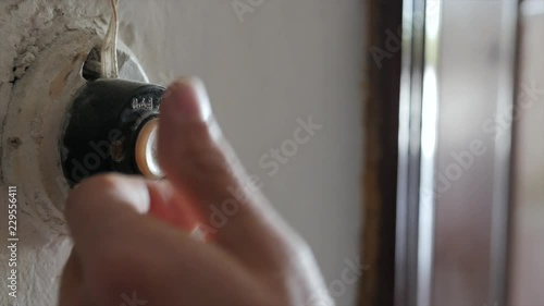 HD A finger presses oldfashion doorbell