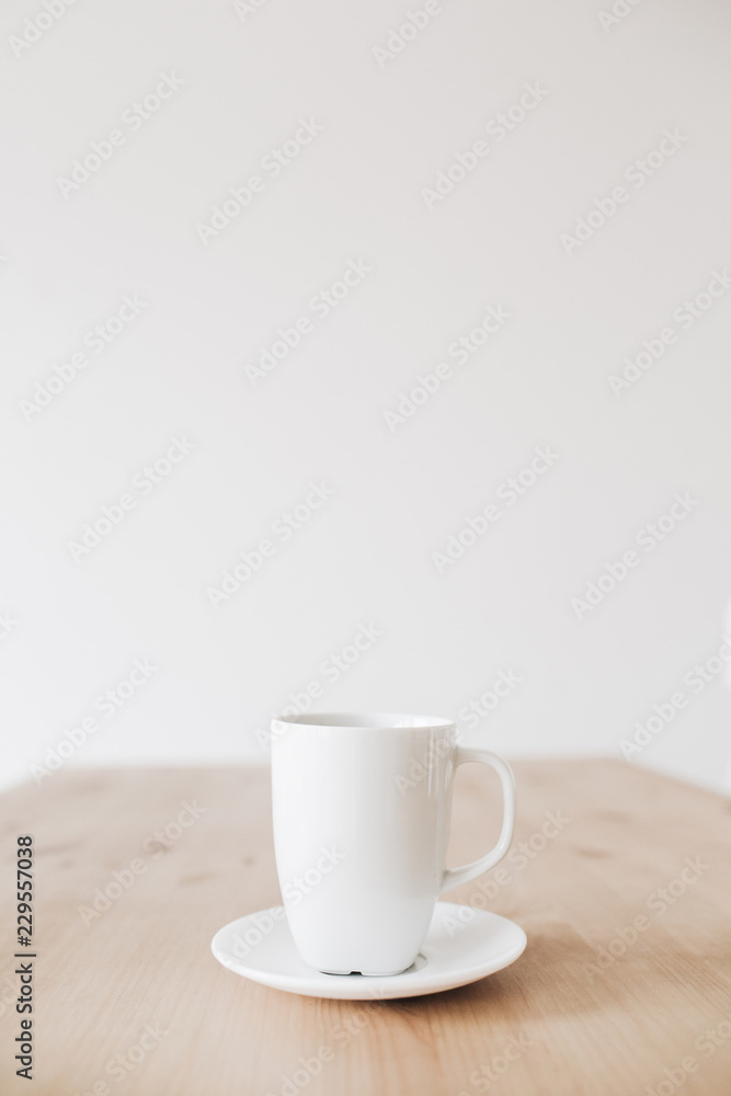 Cup of coffee on clean wooden table. Flat lay, top view. Cup of coffee on clean wooden table. Flat lay, top view.
