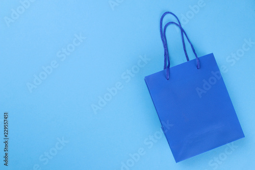 Black Friday. The concept of shopping. sale. Shopping bag on a blue background with a place for an inscription. view from above